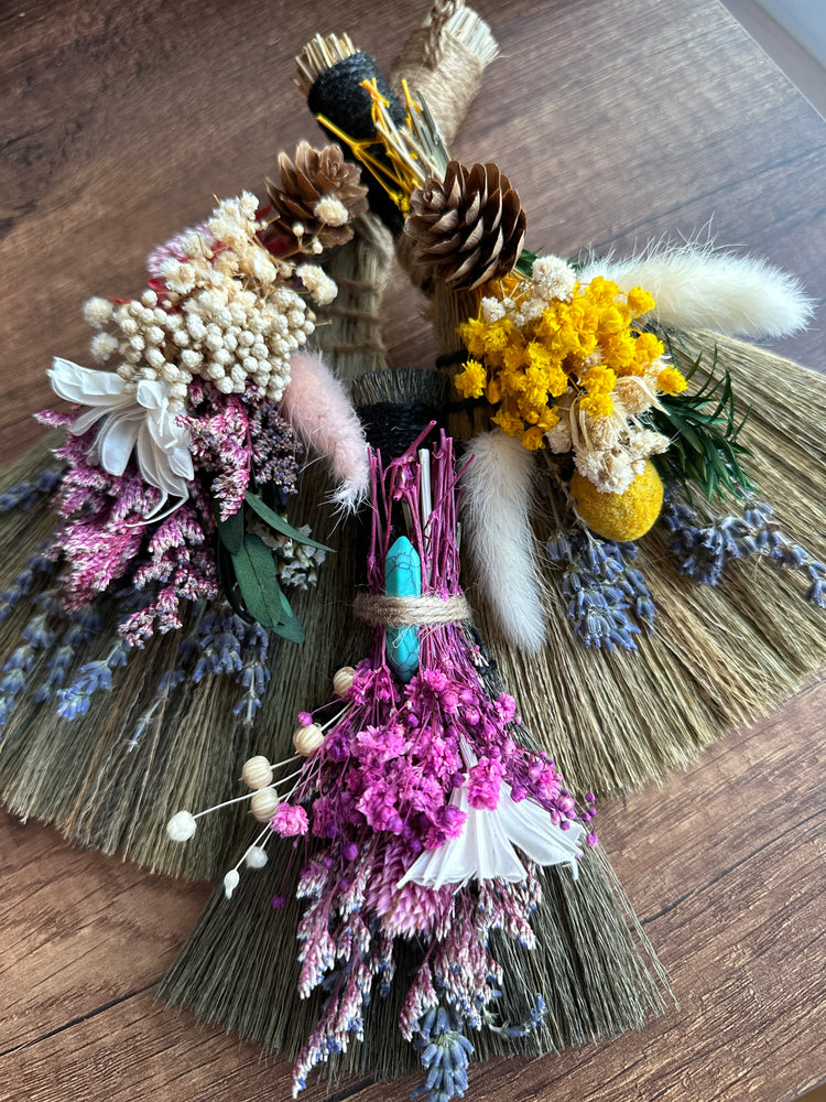 Handmade witch besoms with dried flowers