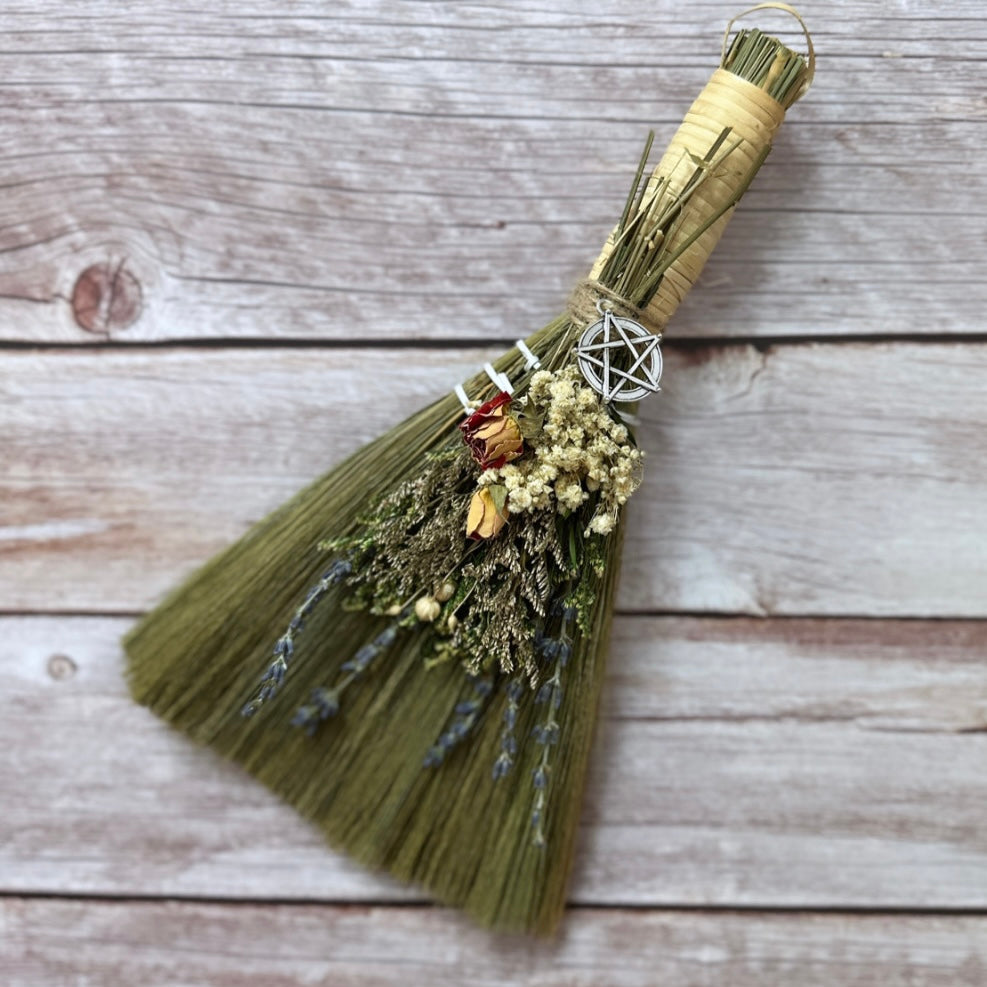 Sweep out negative vibes, adorn your entryway or altar with these hand decorated witch besoms. Charged crystals and charms add to the power behind your broom. ✨🧹🌙  A variety of dried flowers, lavender, rose, marigold, hydrangea, eucalyptus, baby's breath and more are tied with natural twine.