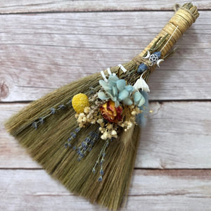 Sweep out negative vibes, adorn your entryway or altar with these hand decorated witch besoms. Charged crystals and charms add to the power behind your broom. ✨🧹🌙  A variety of dried flowers, lavender, rose, marigold, hydrangea, eucalyptus, baby's breath and more are tied with natural twine.