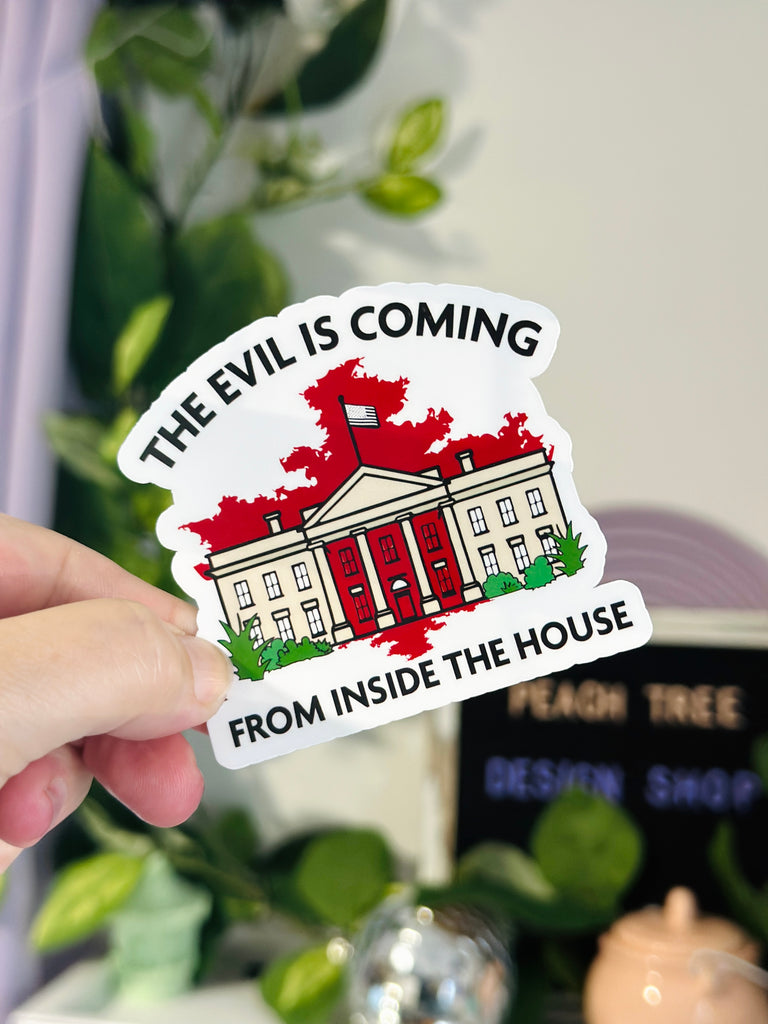 political protest sticker that reads “The Evil Is Coming From Inside the House” with illustration of the White House