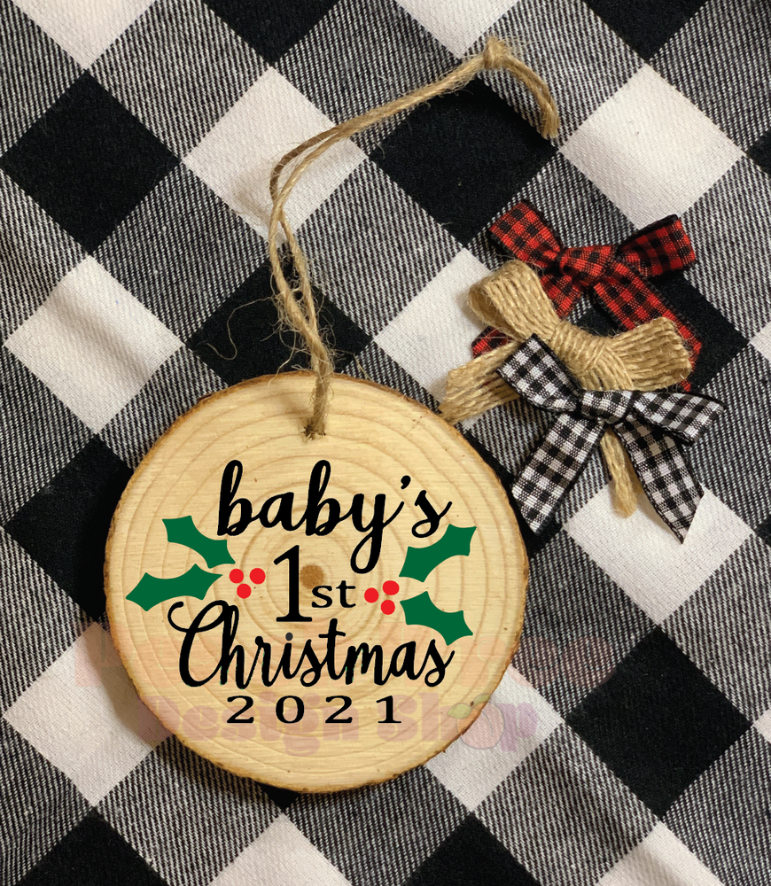 Custom wood slice ornament with baby's 1st Christmas 2021 in black, red and green. Comes with custom bow and optional personalization 